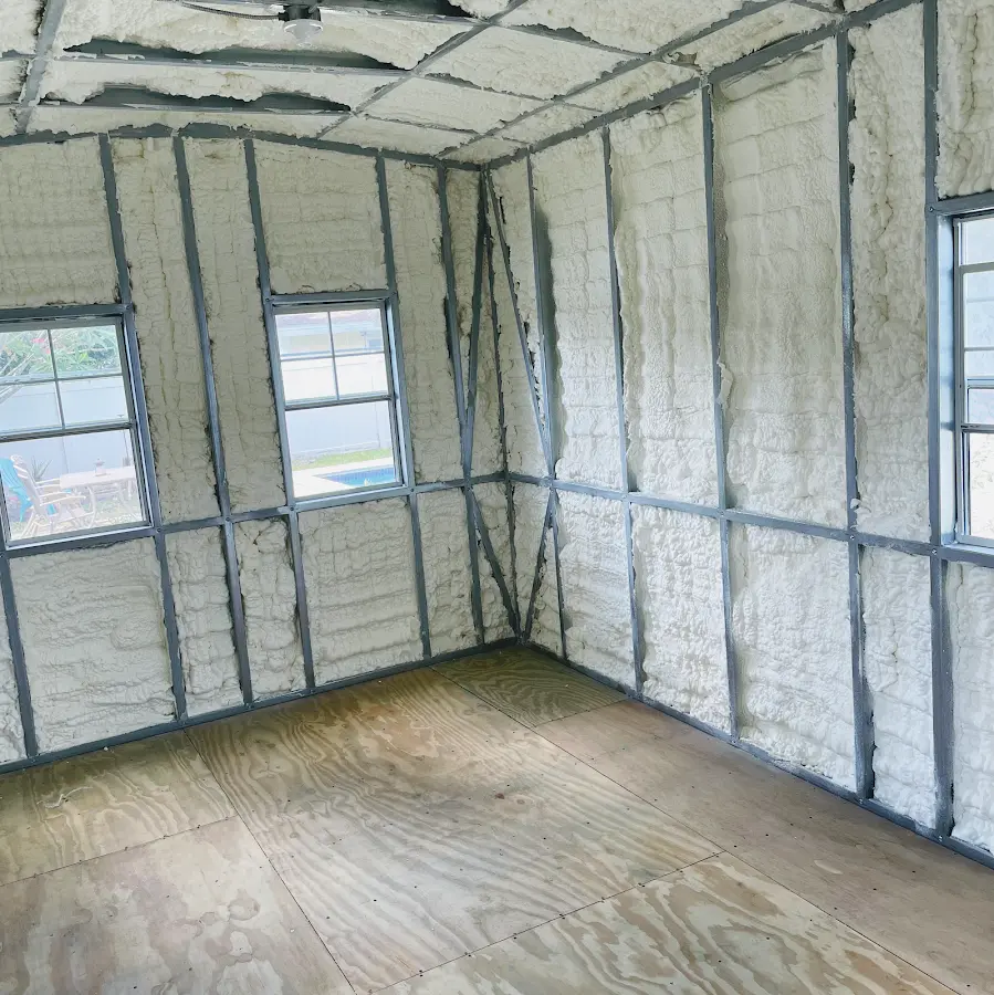 Closed-cell spray foam insulation applied to wall cavities in a residential project in Sedalia